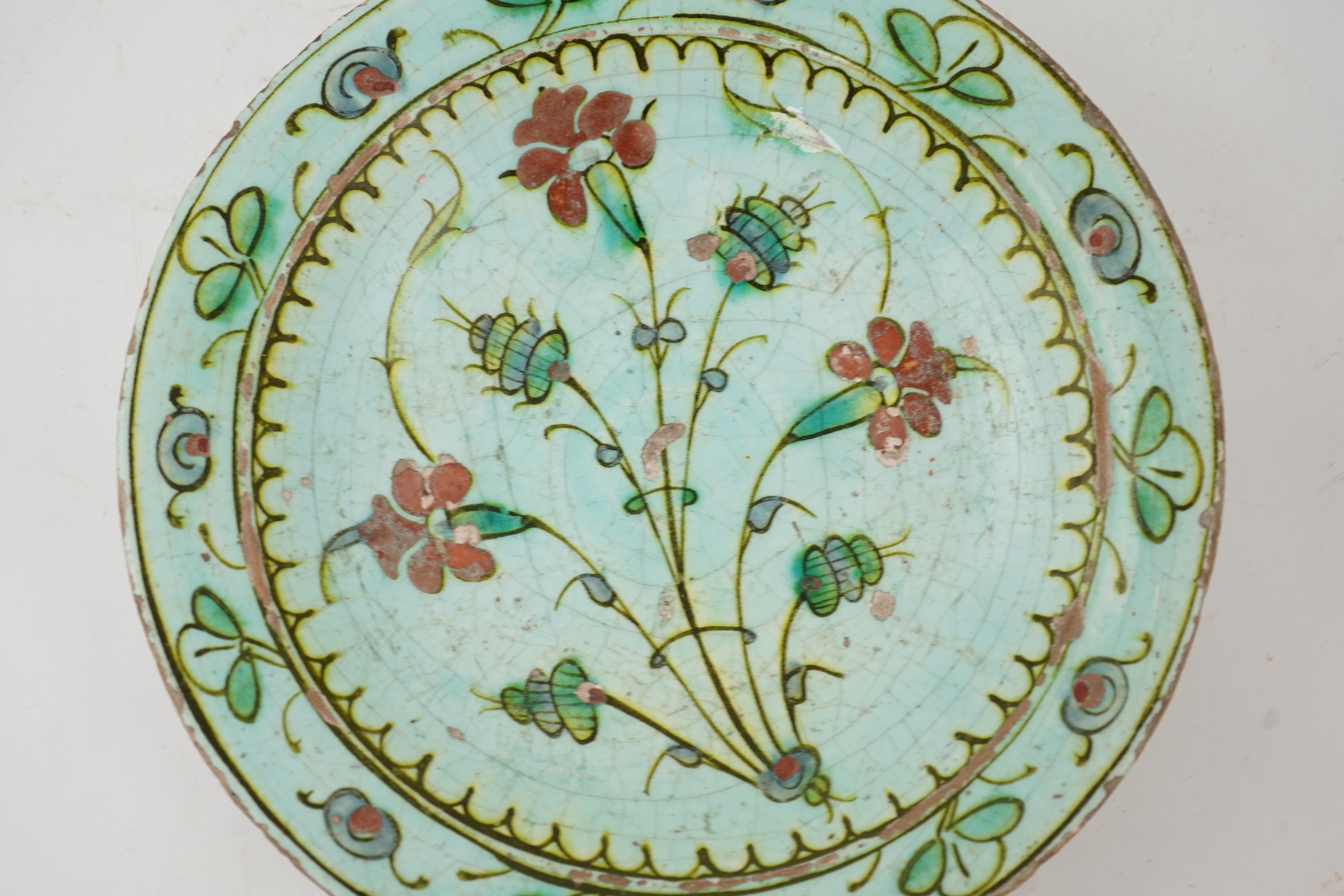 An Iznik pottery turquoise glazed dish, Ottoman Turkey, c.1650-1700